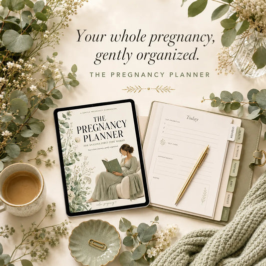 The Pregnancy Planner with open planner, tabbed dividers and eucalyptus on cream desk, complete pregnancy tracker for anxious first-time moms
